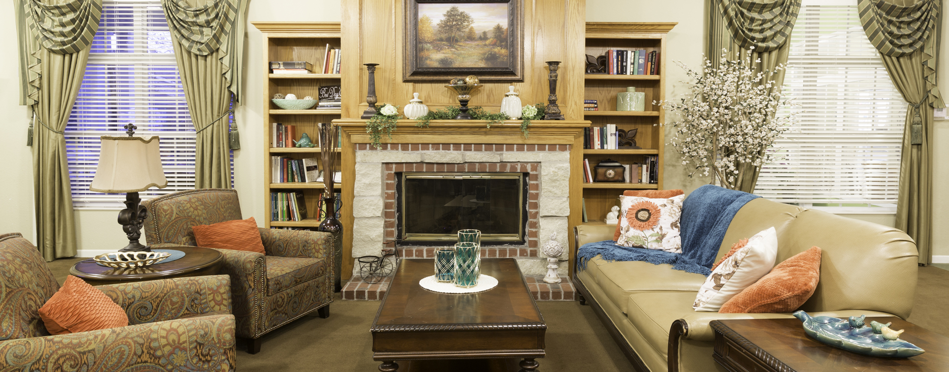 Enjoy a good book in the living room at Bickford of Omaha - Hickory