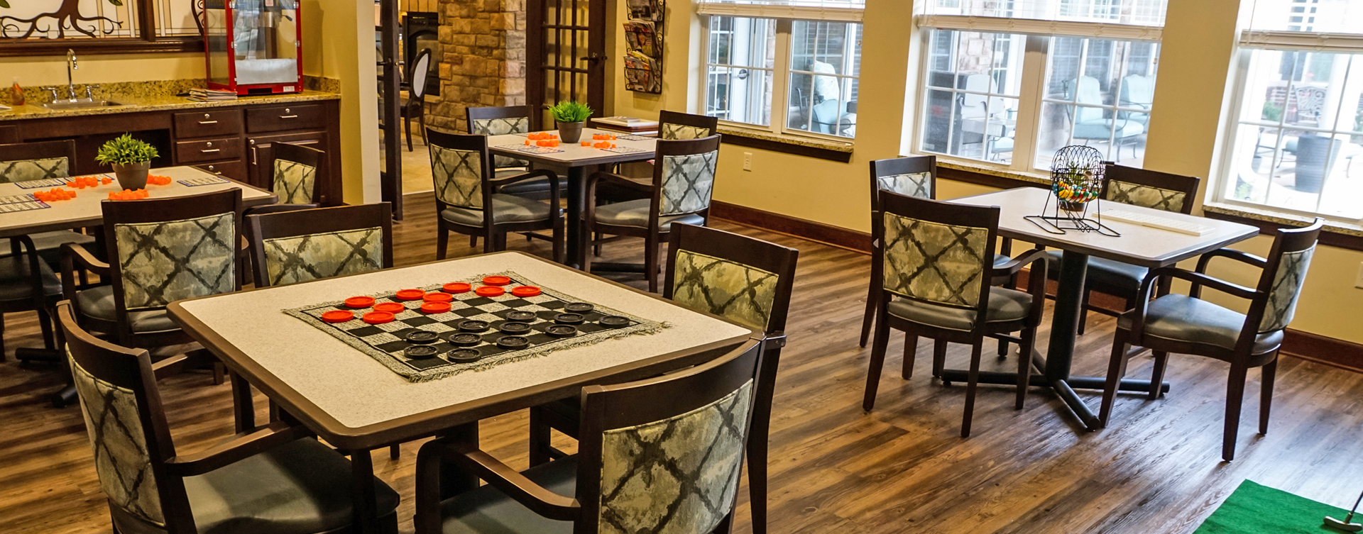 Enjoy a good card game with friends in the activity room at Bickford of Aurora
