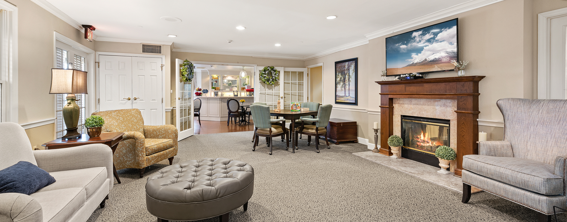 Socialize with friends in the living room at Bickford of Bexley
