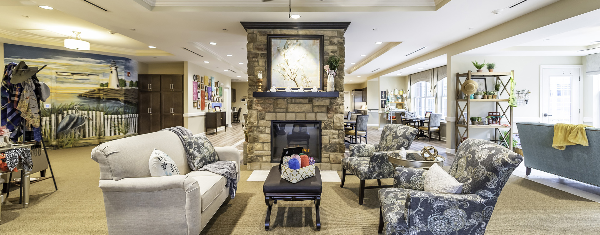 Residents can enjoy furniture covered in cozy fabrics in the Mary B’s living room at Bickford of Canton