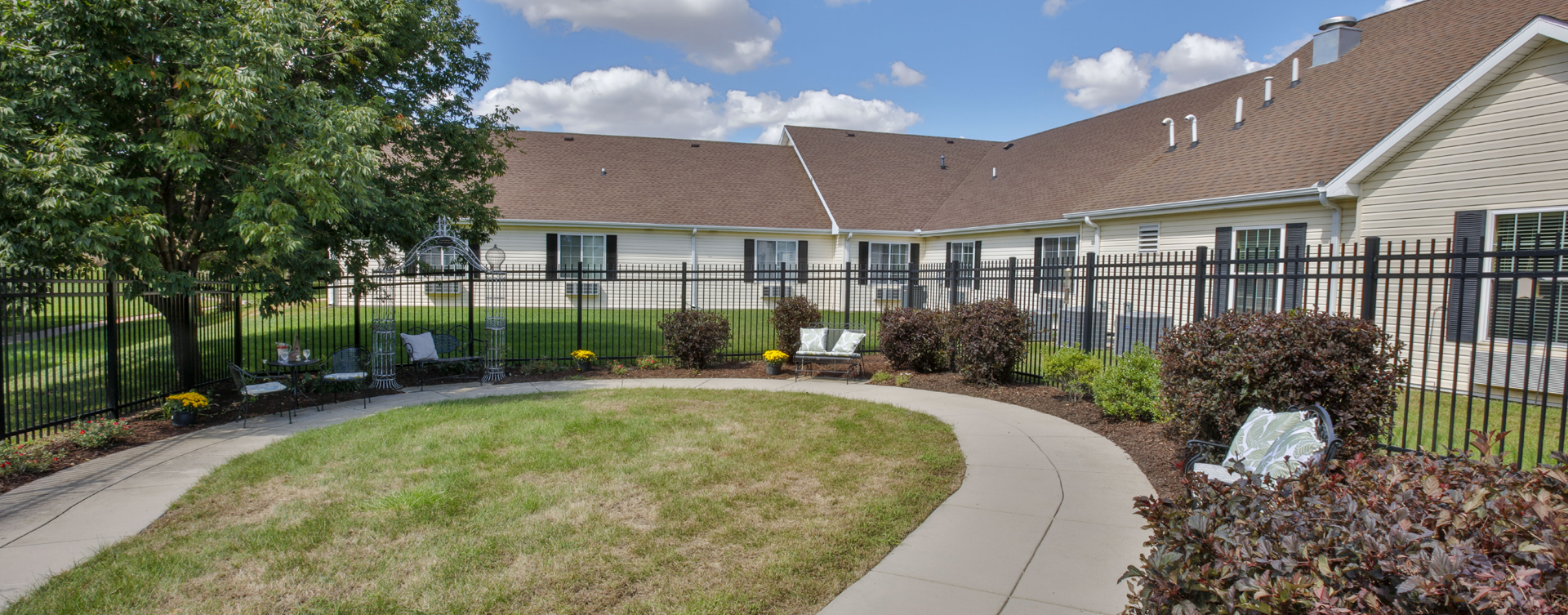 A single entrance courtyard gives residents with dementia the opportunity to be safe outside at Bickford of Champaign