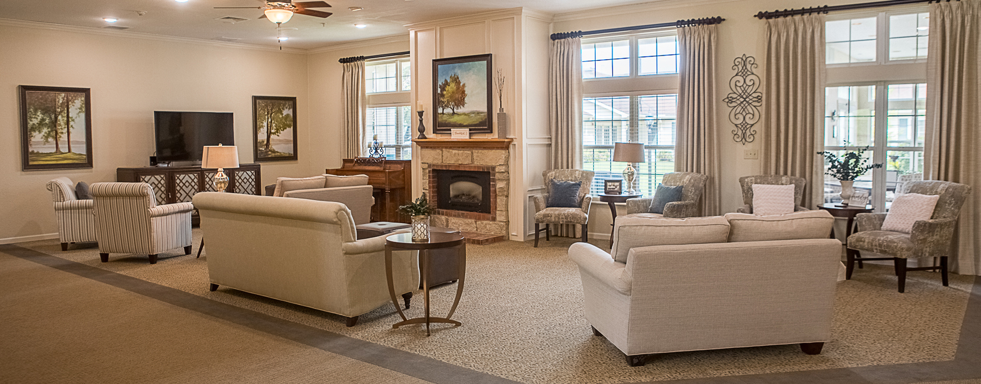 Socialize with friends in the living room at Bickford of Clinton