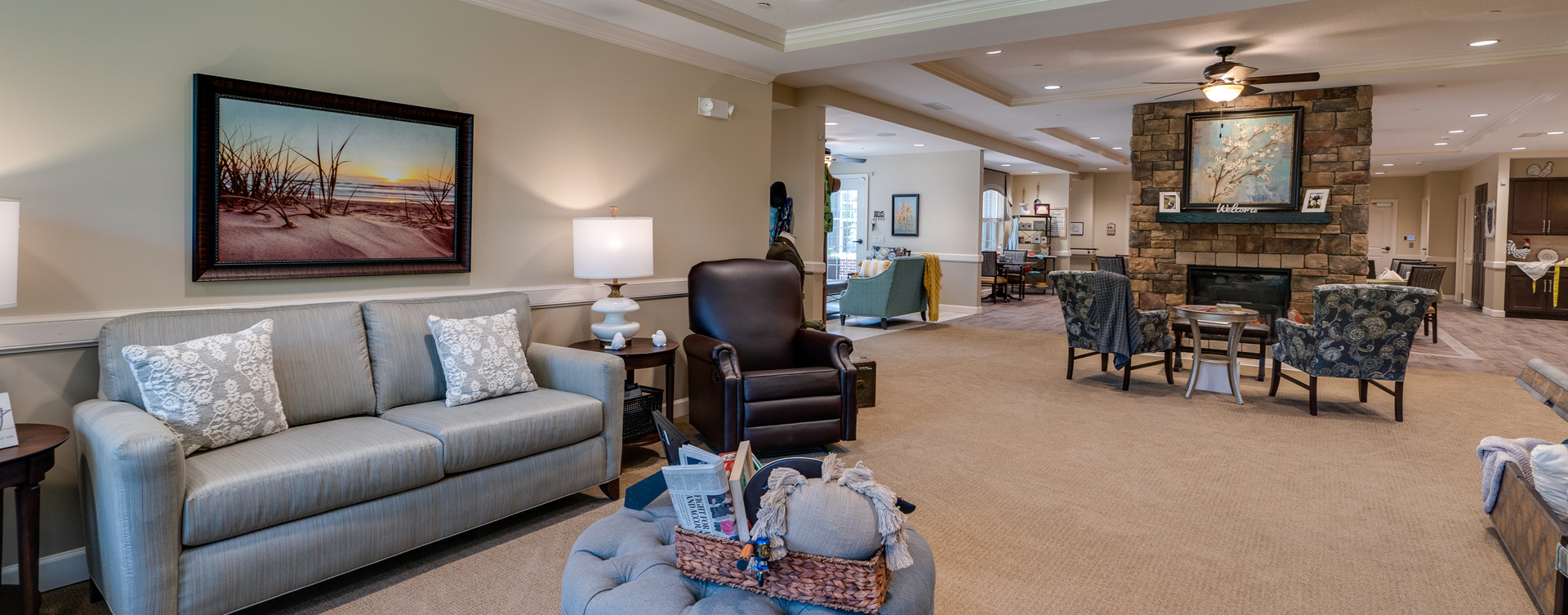 Residents can enjoy furniture covered in cozy fabrics in the Mary B’s living room at Bickford of Chesapeake