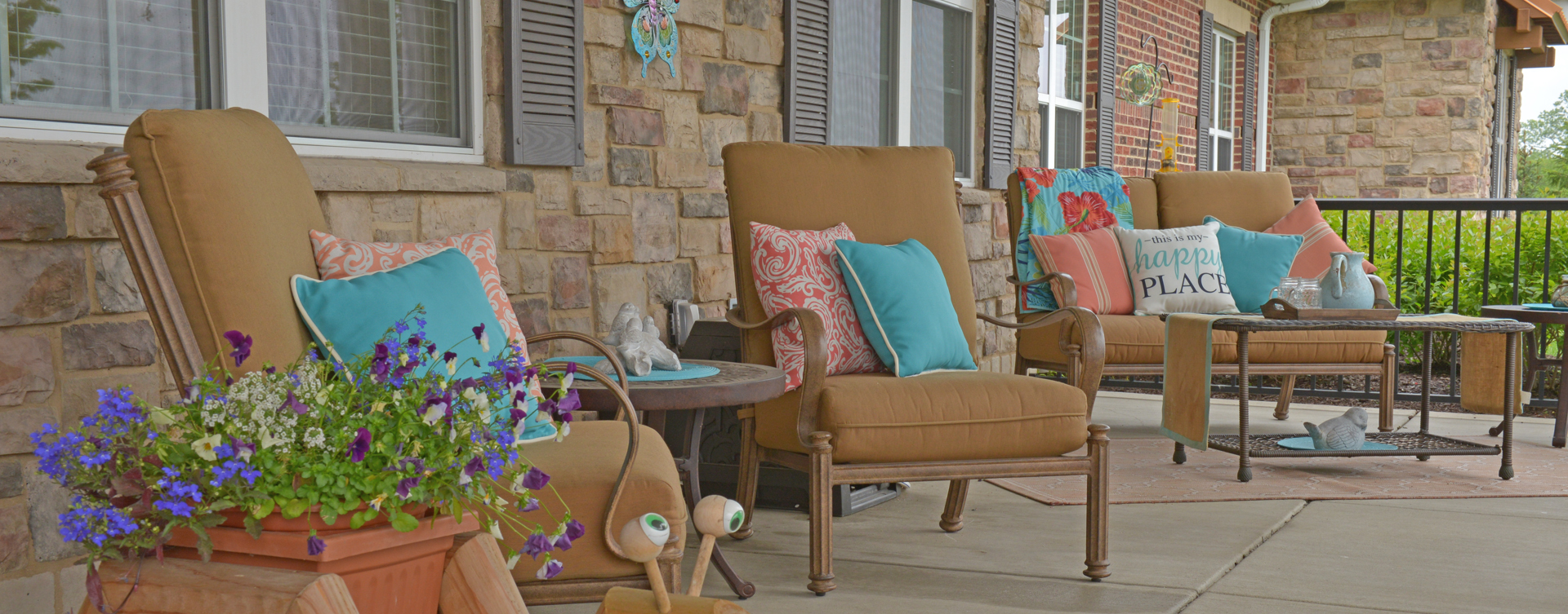 Enjoy conversations with friends on the porch at Bickford of Crown Point