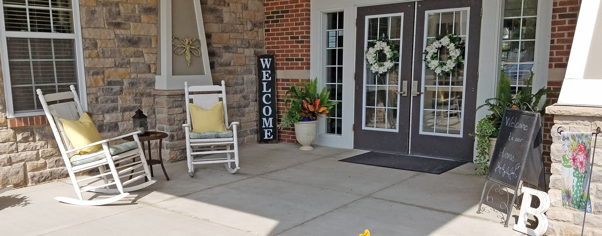 Enjoy conversations with friends on the porch at Bickford of Crystal Lake
