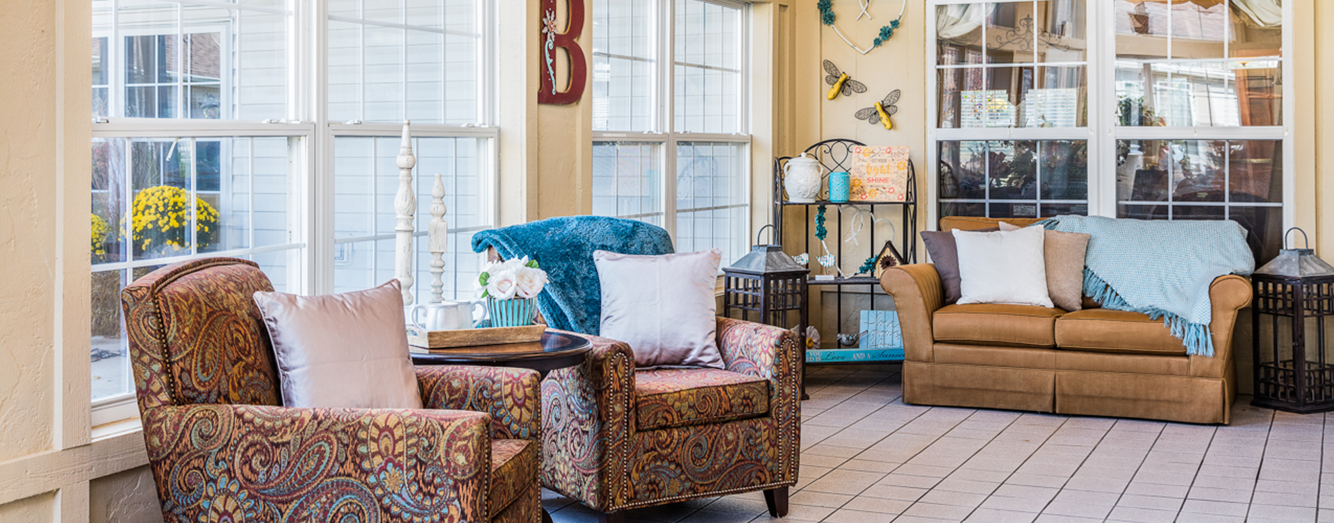 Relax in the warmth of the sunroom at Bickford of Fort Dodge