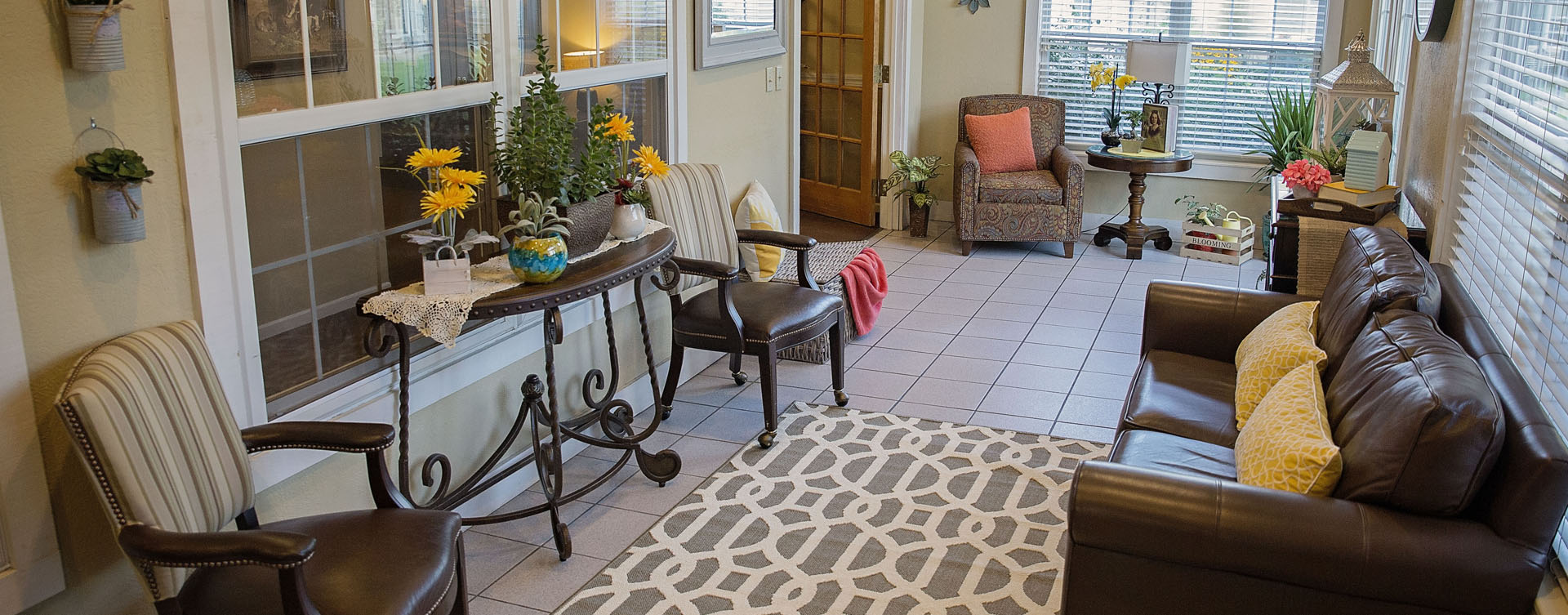 Relax in the warmth of the sunroom at Bickford of Grand Island