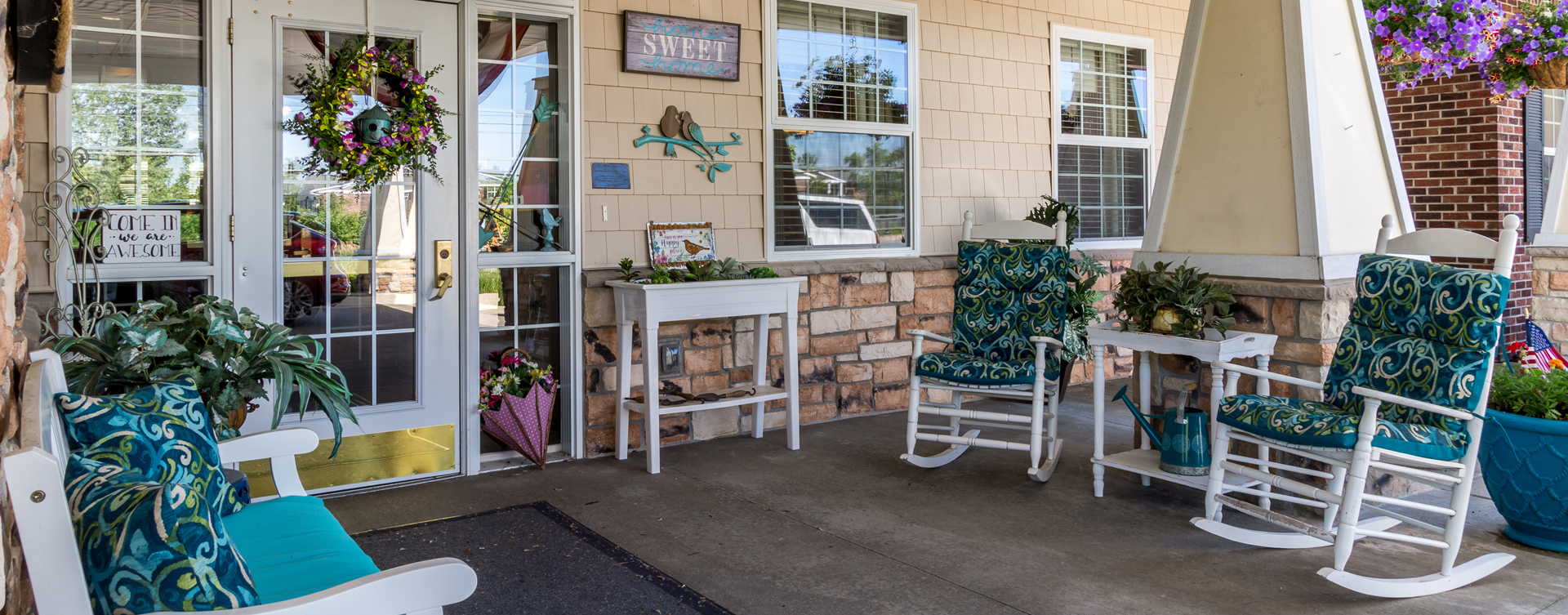 Enjoy conversations with friends on the porch at Bickford of Okemos