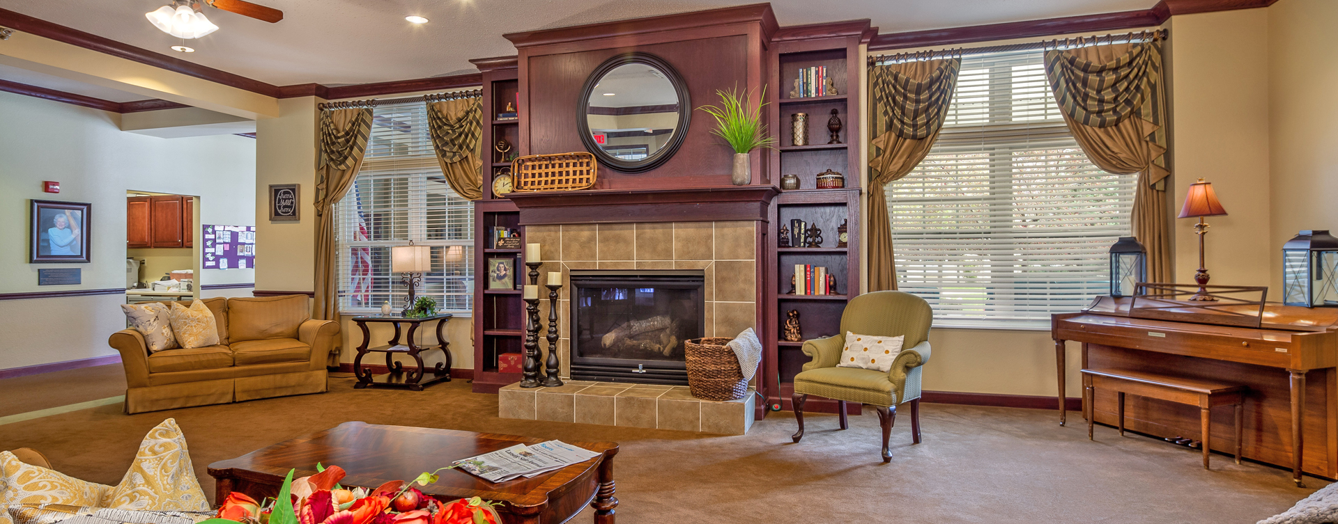 Socialize with friends in the living room at Bickford of Okemos