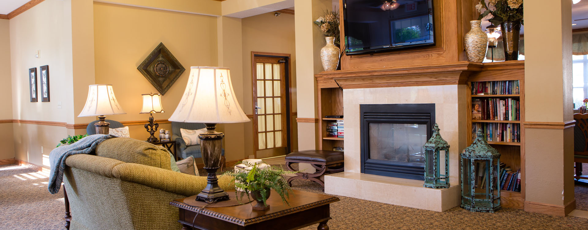 Enjoy a good book in the living room at Bickford of Macomb