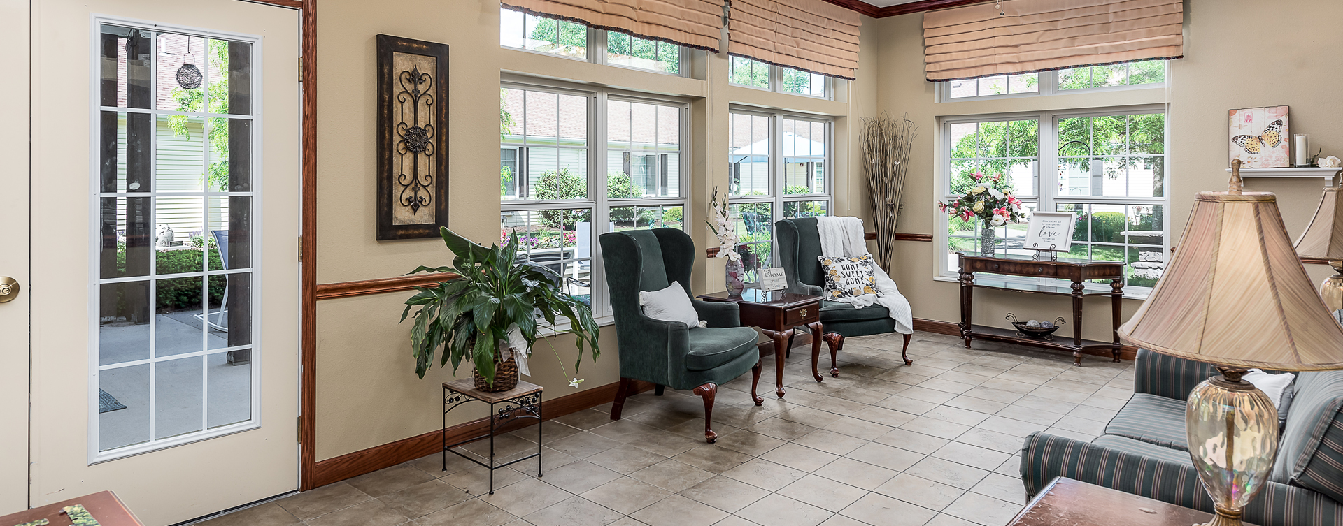 Enjoy the view of the outdoors from the sunroom at Bickford of Midland