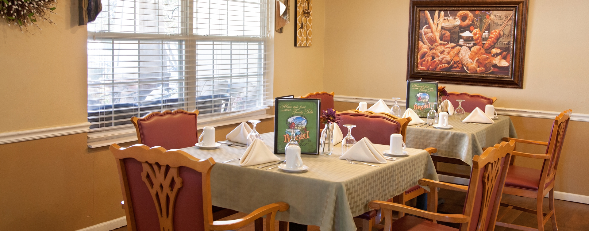 Residents with dementia receive additional assistance with meals in our Mary B’s dining room at Bickford of Marion