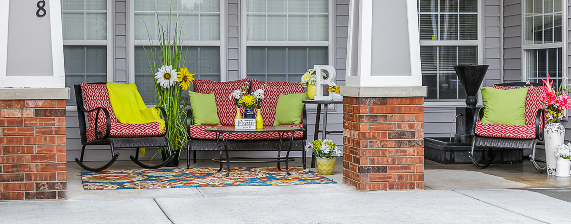 Enjoy conversations with friends on the porch at Bickford of Omaha - Blondo