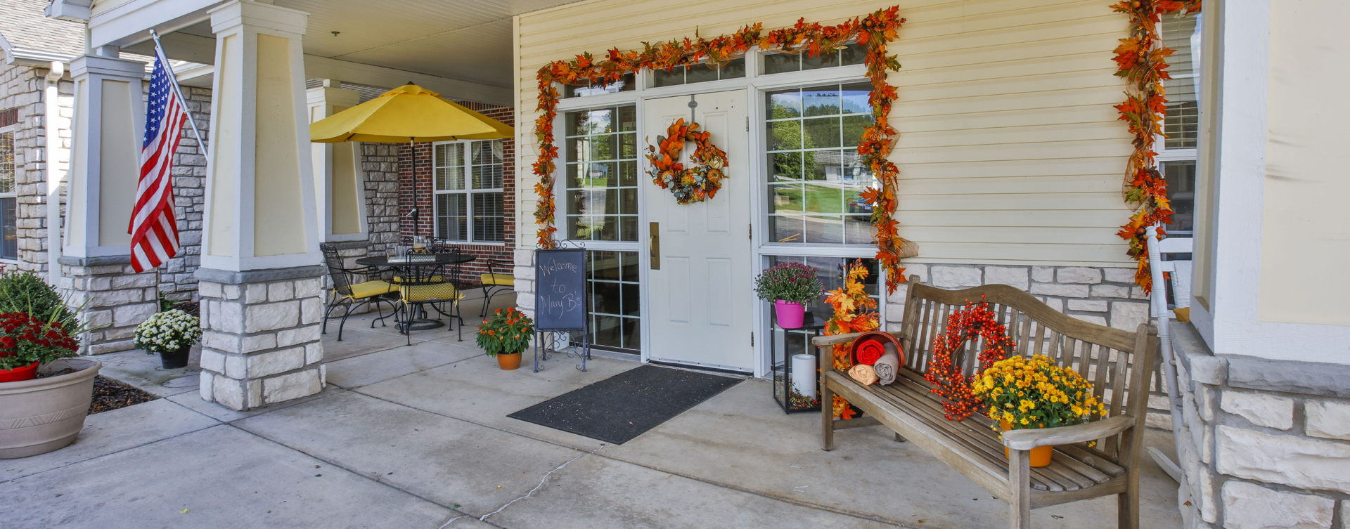 Enjoy conversations with friends on the porch at Bickford of Peoria
