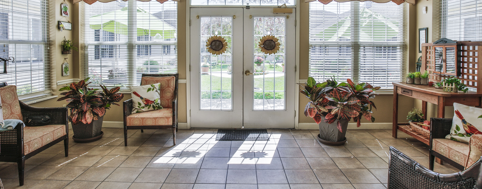 Relax in the warmth of the sunroom at Bickford of Peoria