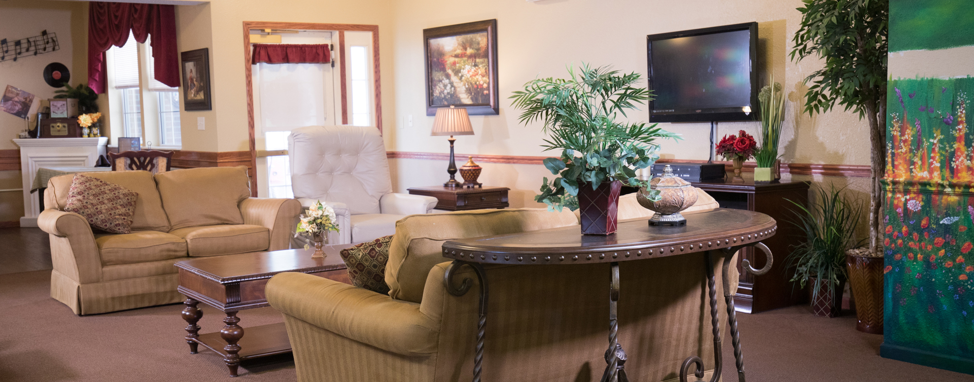 Residents can enjoy furniture covered in cozy fabrics in the Mary B’s living room at Bickford of Quincy