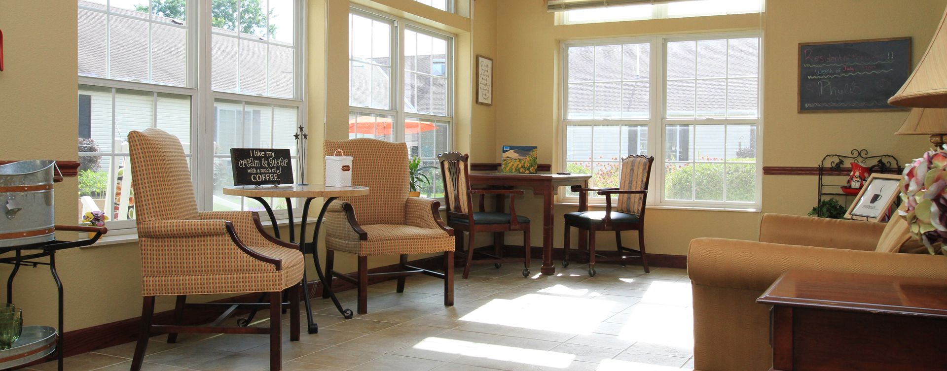 Curl up with a good book in the sunroom at Bickford of Saginaw Township