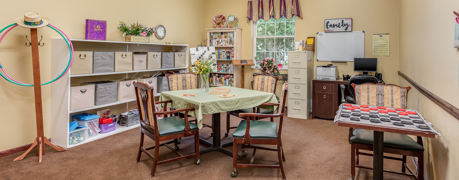 Enjoy a good card game with friends in the activity room at Bickford of Saginaw Township