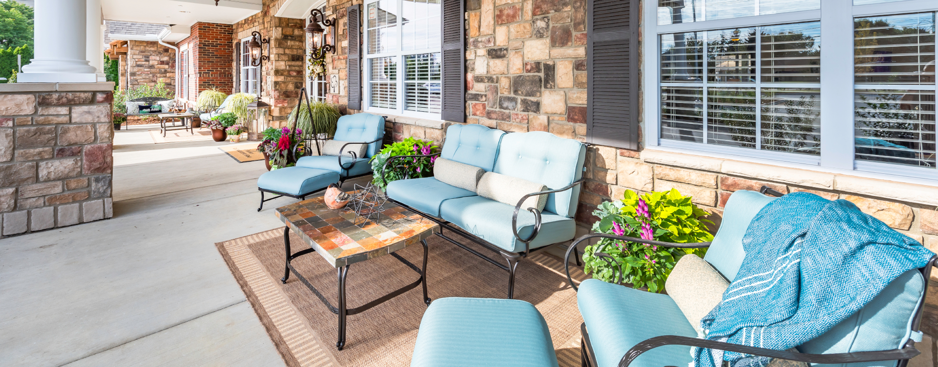Enjoy conversations with friends on the porch at Bickford of Shelby Township