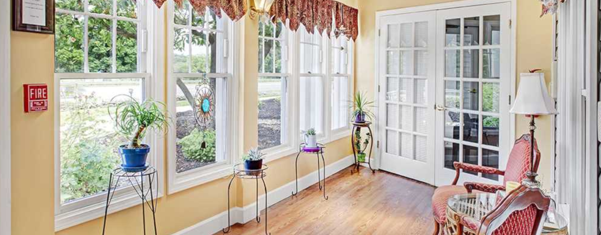 Enjoy the view of the outdoors from the sunroom at Bickford of Upper Arlington