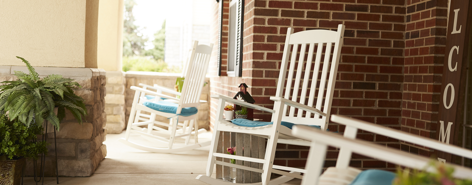 Enjoy conversations with friends on the porch at Bickford of Springfield