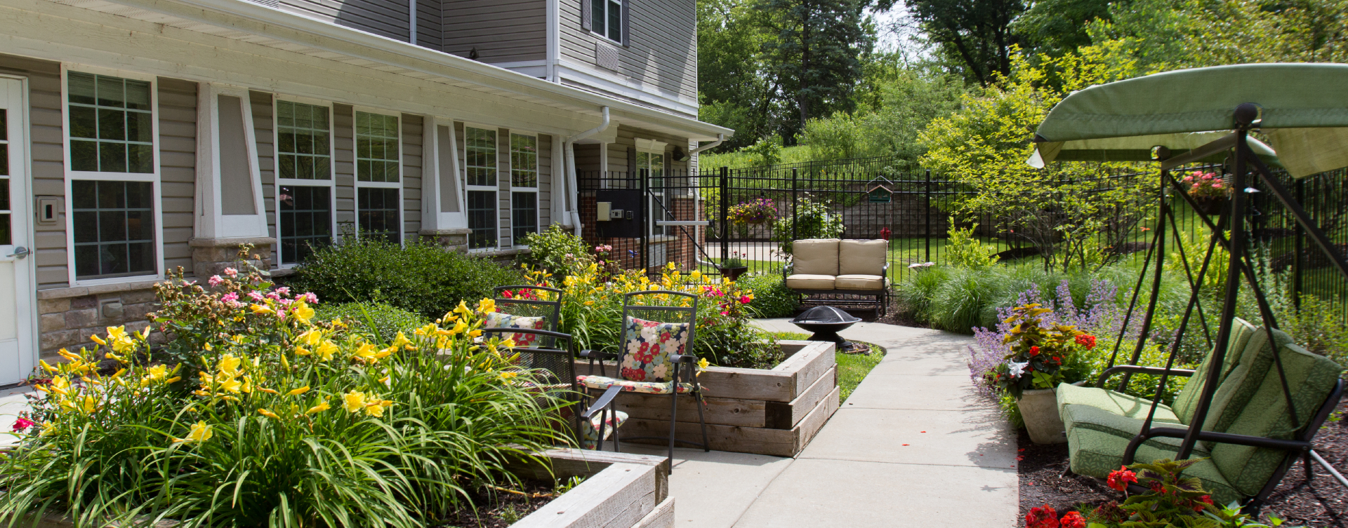 Residents with dementia can enjoy a traveling path, relaxed seating and raised garden beds in the courtyard at Bickford of St. Charles