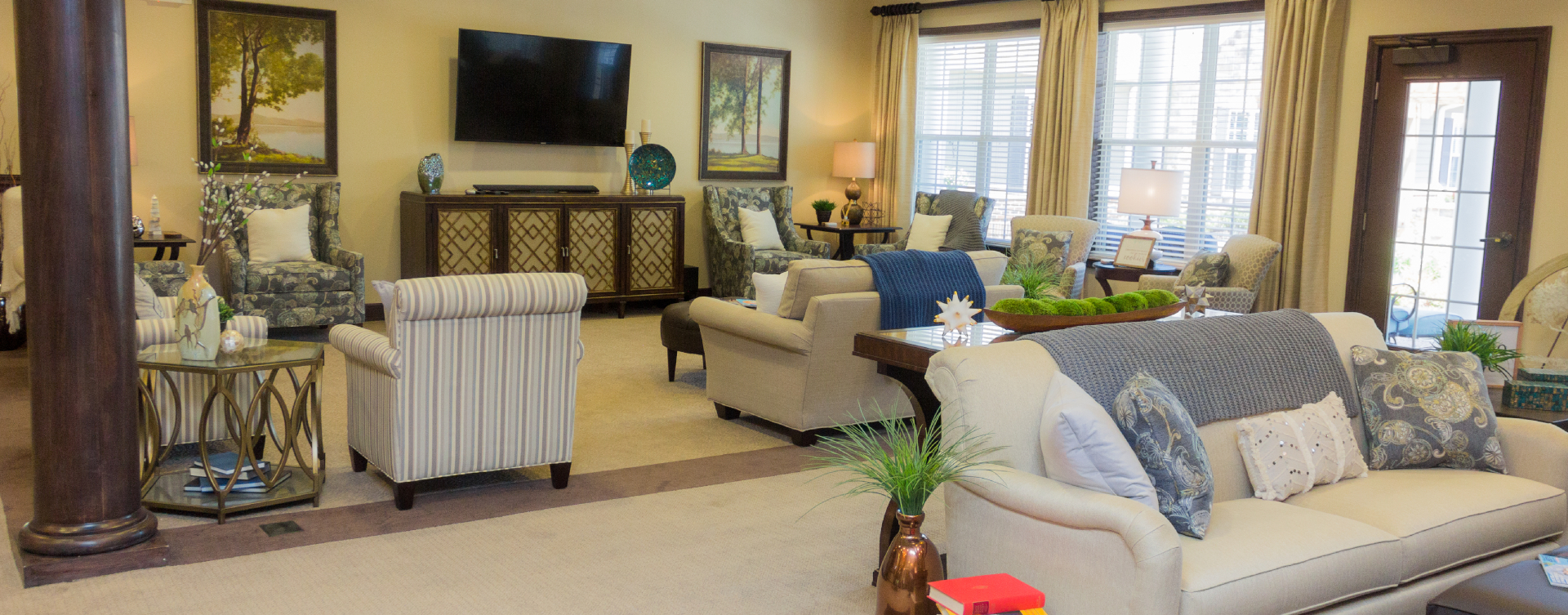 Socialize with friends in the living room at Bickford of Suffolk