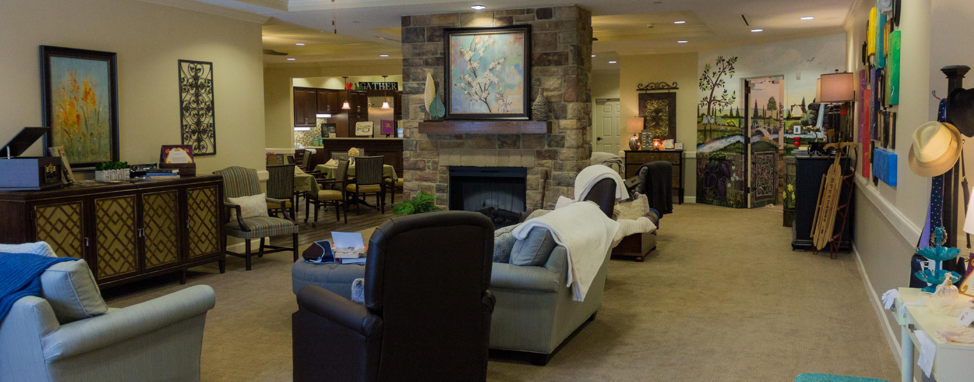 Residents can enjoy furniture covered in cozy fabrics in the Mary B’s living room at Bickford of Suffolk