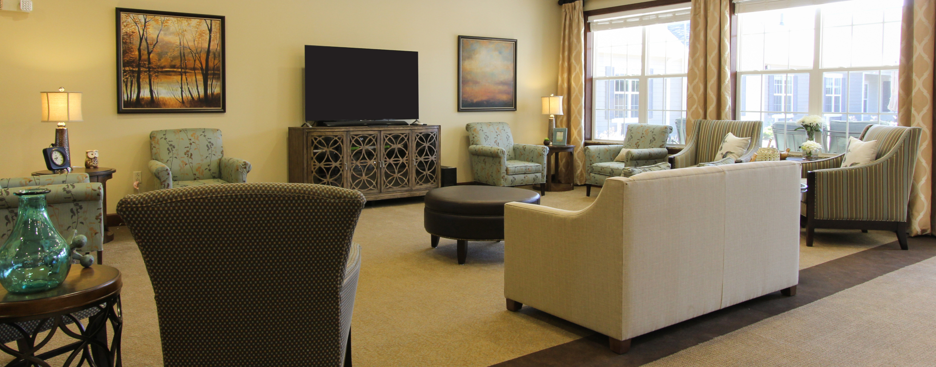 Socialize with friends in the living room at Bickford of Tinley Park