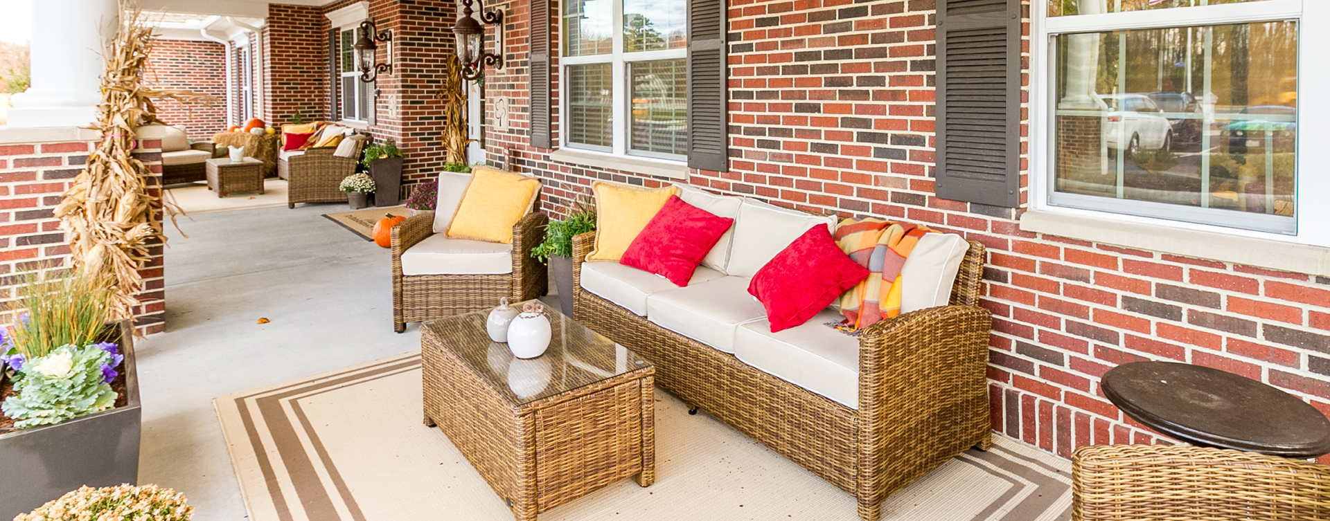 Enjoy conversations with friends on the porch at Bickford of Virginia Beach