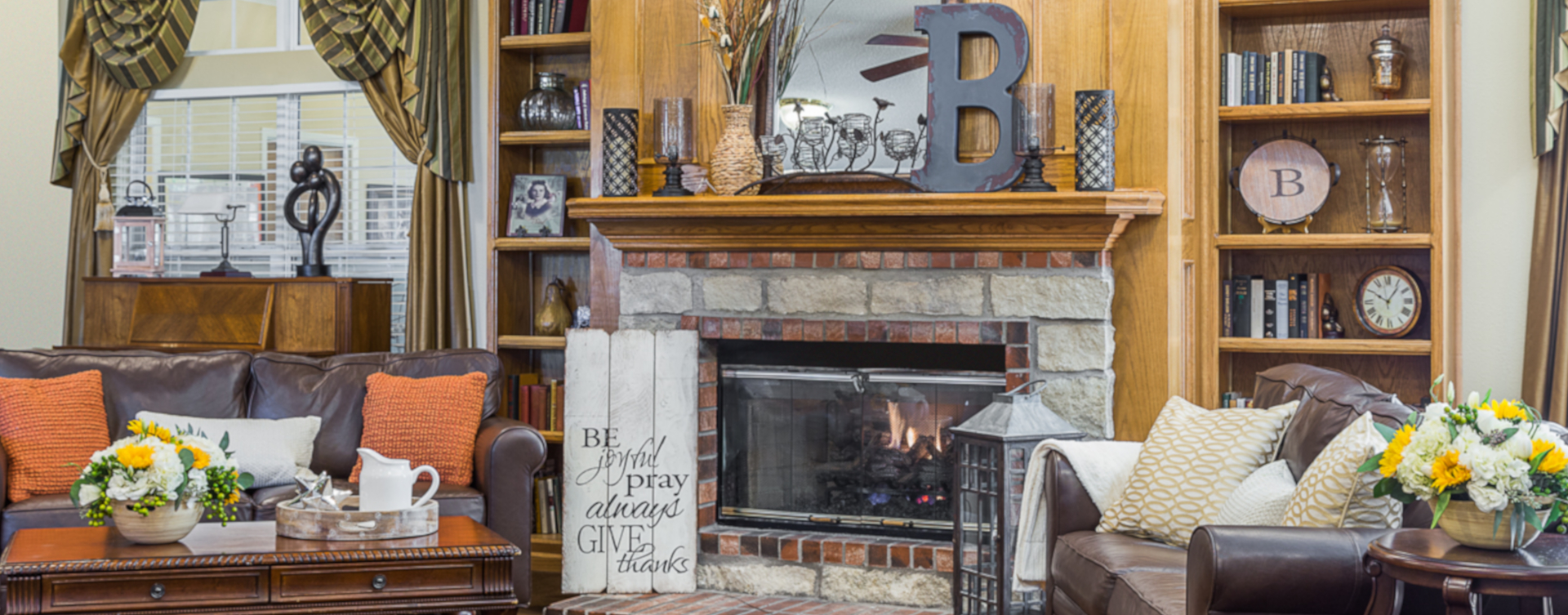 Enjoy a good book in the living room at Bickford of West Des Moines