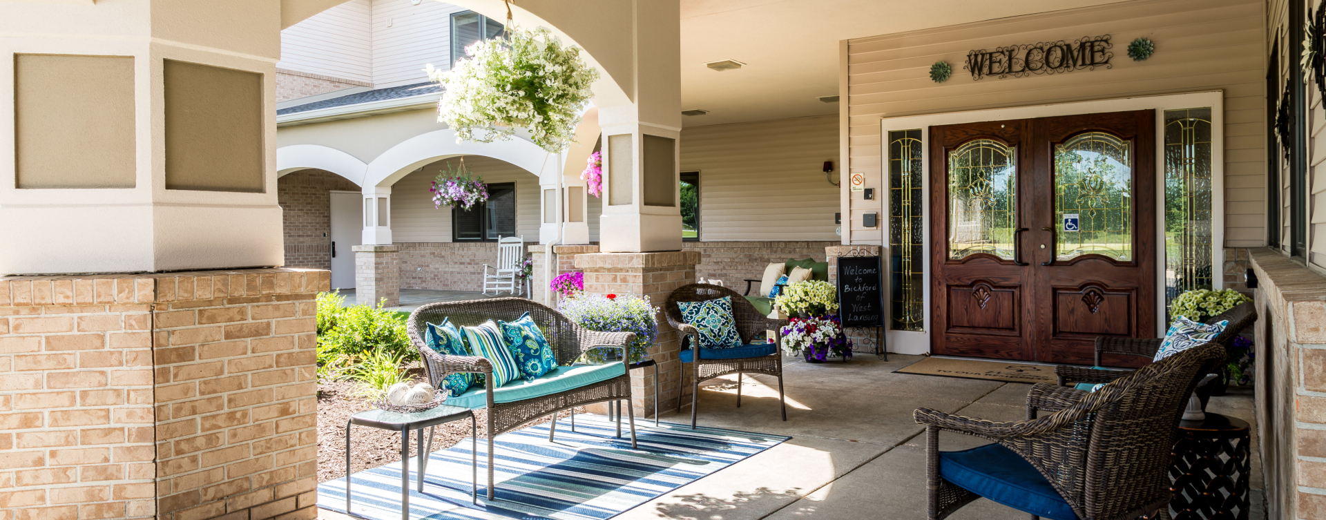 Sip on your favorite drink on the porch at Bickford of West Lansing